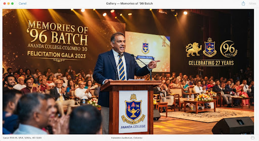 Dynamic wide stage photograph featuring warm theatrical stage lighting beaming on an eloquent batch speaker