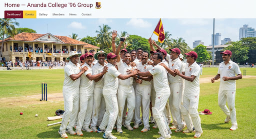 Sri Lankan alumni in pristine white cricket flannels celebrating victory on a lush green cricket oval under brilliant tropical sunshine. Enthusiastic team hugs, maroon caps, and spirited camaraderie capture collegiate athletic pride.