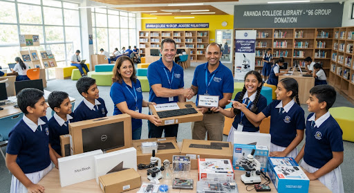 Alumni volunteers handing over new computer hardware and science lab equipment to enthusiastic junior school students inside a bright modern school library, symbolizing academic philanthropy and selfless dedication.